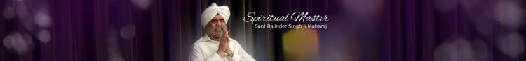 Sant Rajinder Singh Ji Maharaj, in a white turban, greeting with palms folded before a dark curtain
