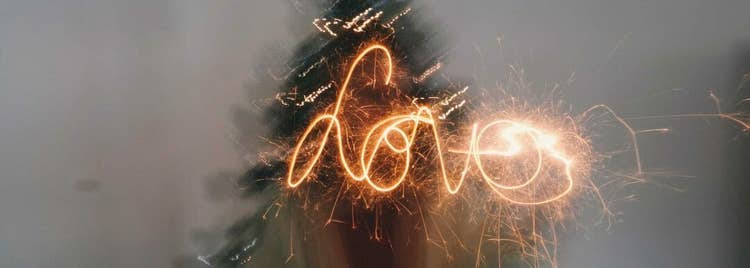 Light of a sparkler traces the word