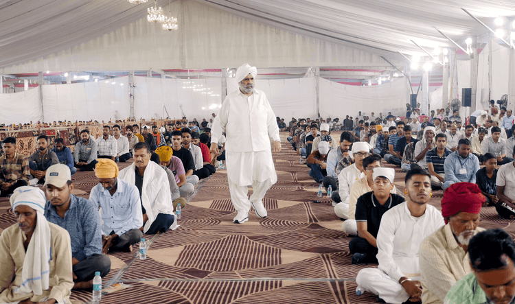 Vast gathering seated under a canopy at a Sawan Kirpal Ruhani Mission program in India